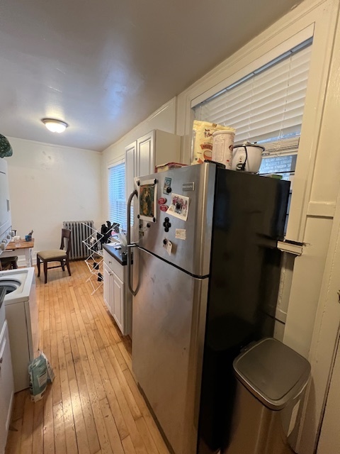 4224 North Clark Street, Unit 3 Chicago, IL 60613 - Photo 11 of 15 a kitchen with sink a refrigerator a washer and dryer
