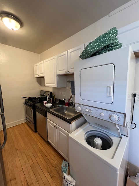 4224 North Clark Street, Unit 3 Chicago, IL 60613 - Photo 8 of 15 a kitchen with a stove and a white wooden cabinets