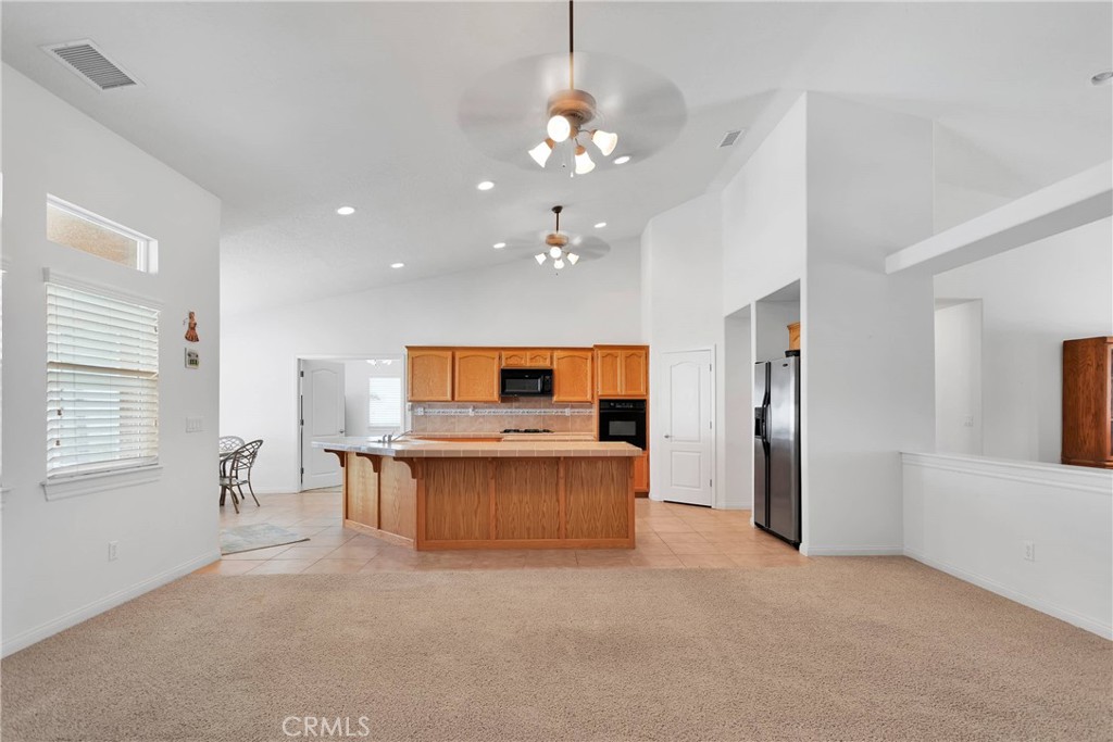 17367 Central Road Apple Valley, CA 92307 - Photo 15 of 61 a living room with stainless steel appliances kitchen island granite countertop furniture and a kitchen view
