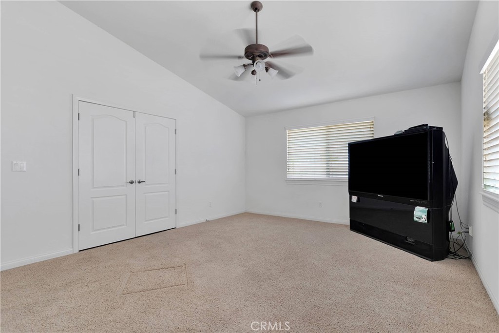 17367 Central Road Apple Valley, CA 92307 - Photo 20 of 61 a living room with a flat screen tv and a window