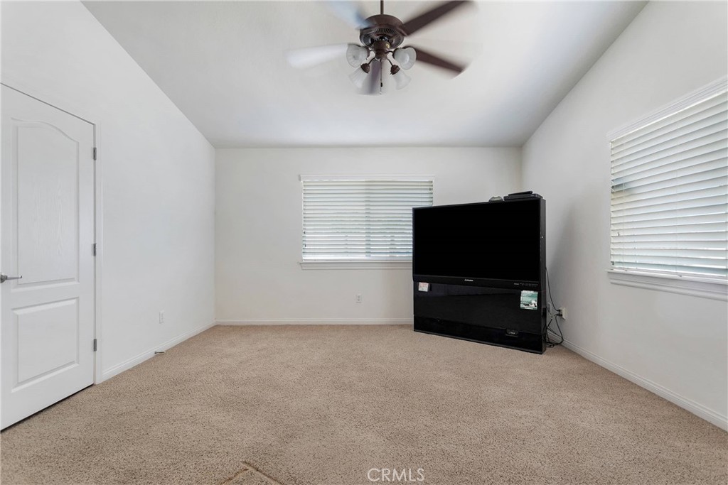 17367 Central Road Apple Valley, CA 92307 - Photo 21 of 61 an empty room with windows cabinet and mirror