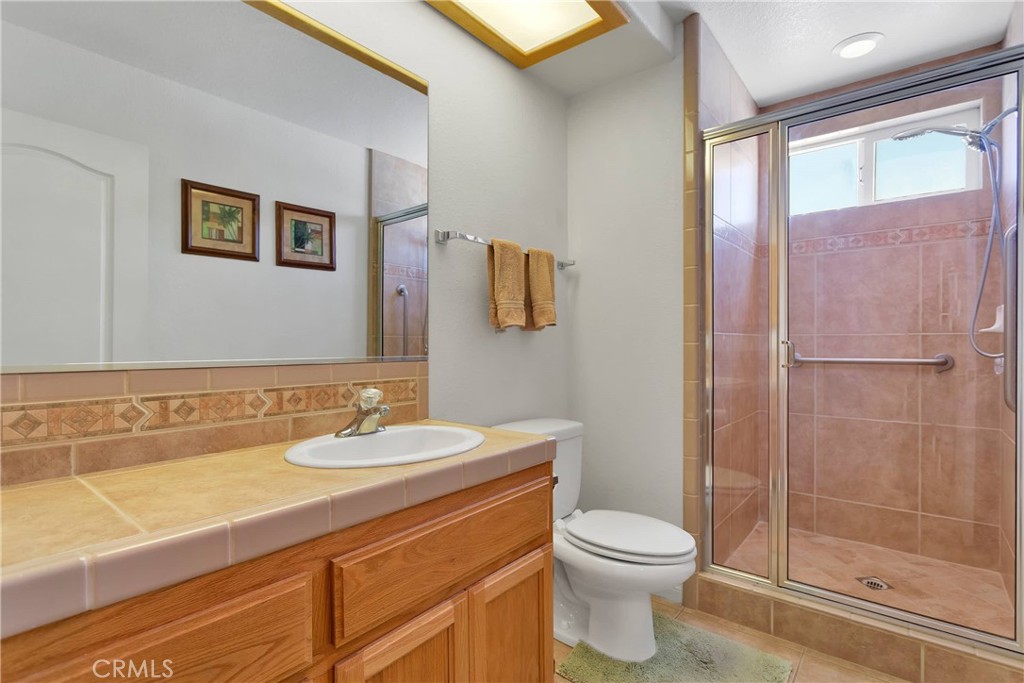17367 Central Road Apple Valley, CA 92307 - Photo 26 of 61 a bathroom with a sink a toilet and shower