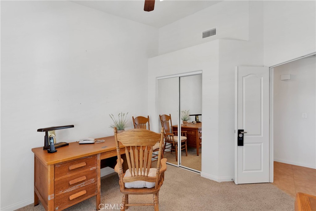 17367 Central Road Apple Valley, CA 92307 - Photo 32 of 61 a view of a dining room with furniture and wooden floor