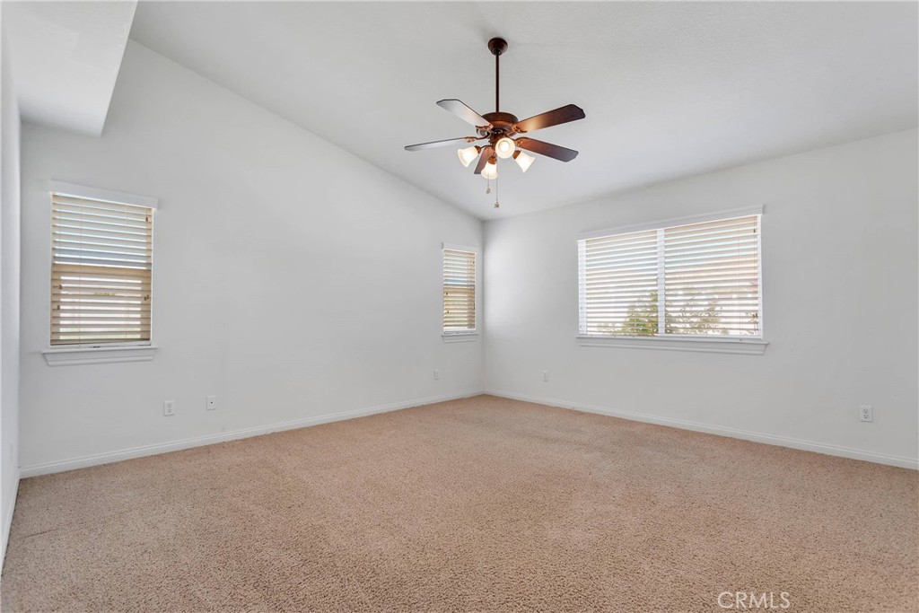 17367 Central Road Apple Valley, CA 92307 - Photo 39 of 61 a view of a room with windows and chandelier fan