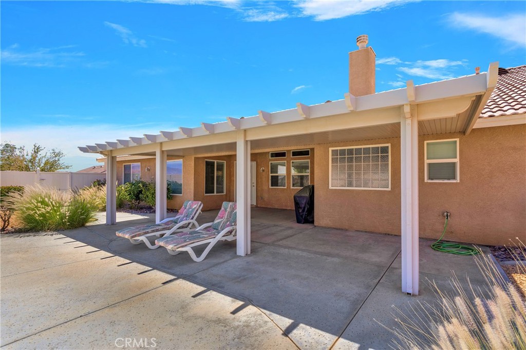 17367 Central Road Apple Valley, CA 92307 - Photo 48 of 61 a house view with a sitting space and garden