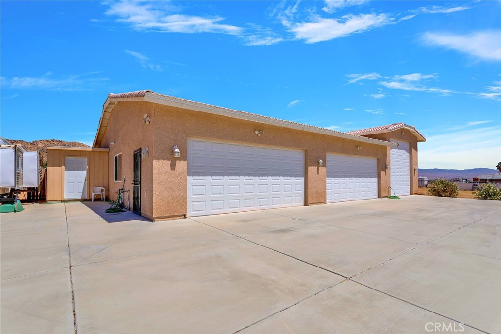 17367 Central Road Apple Valley, CA 92307 - Photo 55 of 61 a view of a house with a road