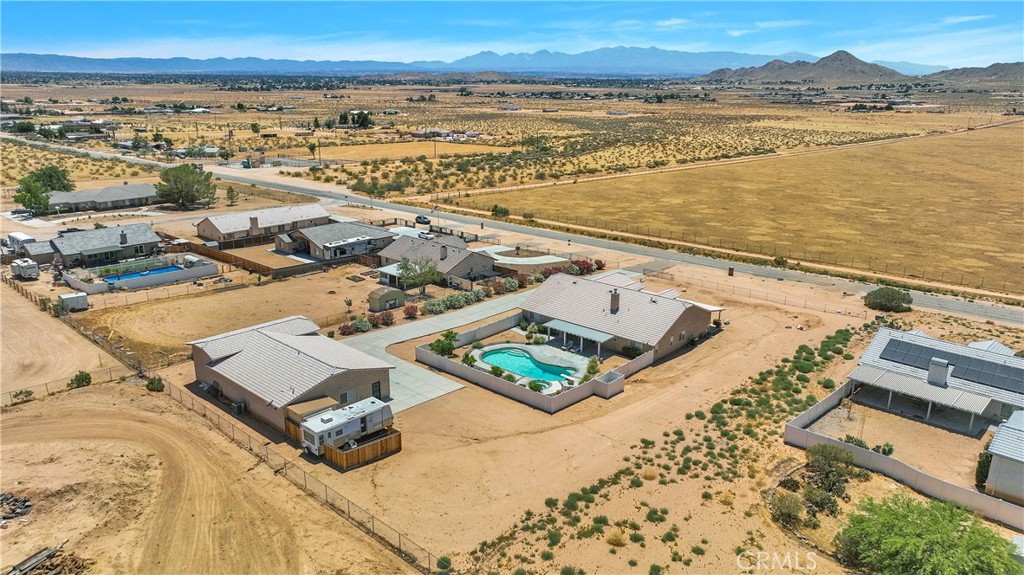 17367 Central Road Apple Valley, CA 92307 - Photo 58 of 61 an aerial view of residential houses with outdoor space