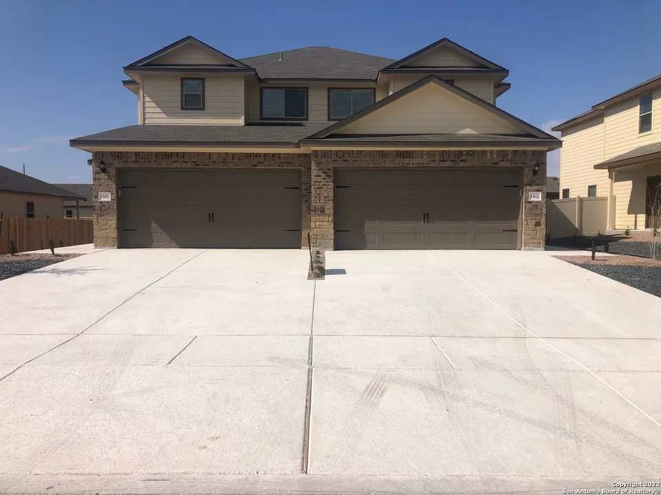 1502 Lucille Street Seguin, TX 78155 - Photo 1 of 13 a front view of a house with garage