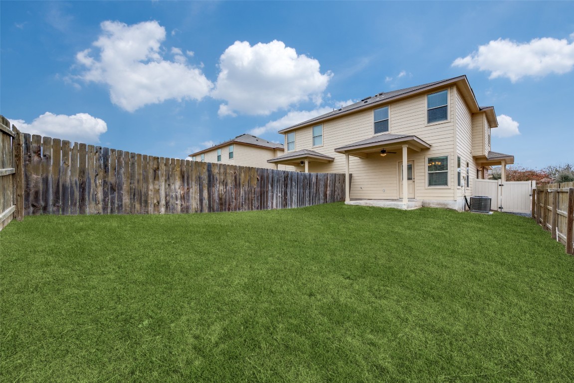 1502 Lucille Street Seguin, TX 78155 - Photo 13 of 13 a front view of a house with garden