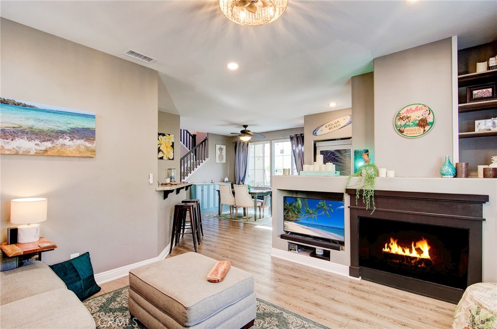 13069 Arborwalk Lane Tustin, CA 92782 - Photo 11 of 47 a living room with furniture and a fireplace