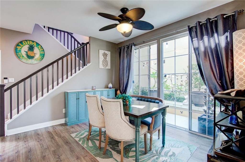 13069 Arborwalk Lane Tustin, CA 92782 - Photo 16 of 47 a dining room with furniture entryway and wooden floor