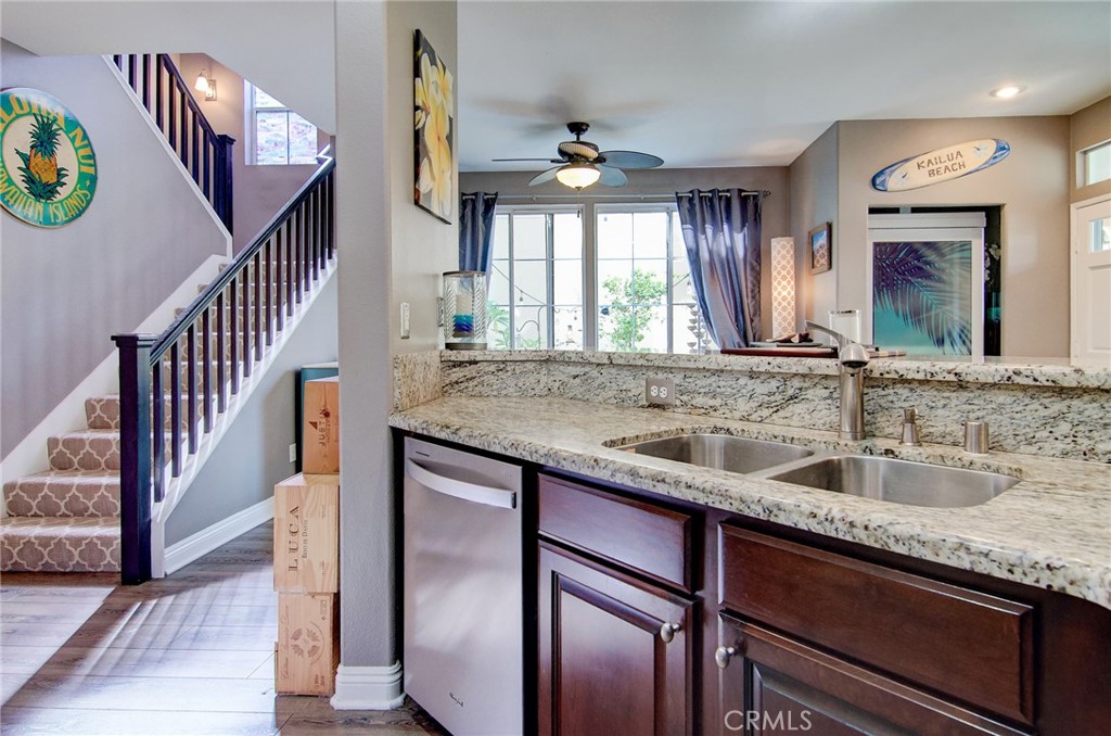 13069 Arborwalk Lane Tustin, CA 92782 - Photo 20 of 47 a kitchen with sink and mirror
