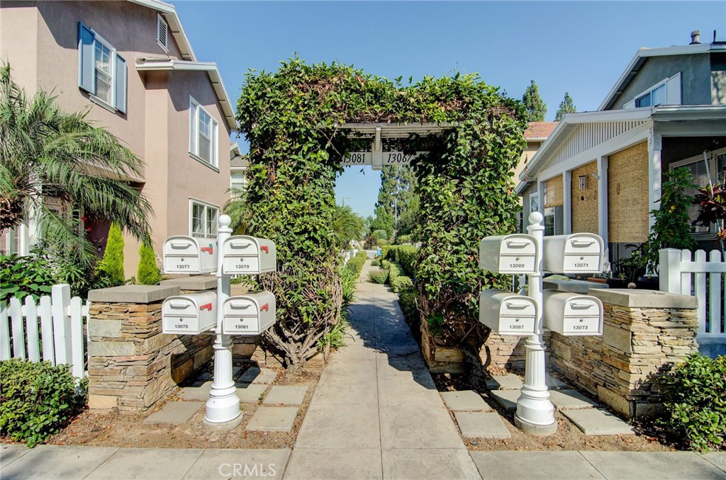 13069 Arborwalk Lane Tustin, CA 92782 - Photo 2 of 47 front view of a house with a garden
