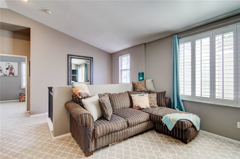 13069 Arborwalk Lane Tustin, CA 92782 - Photo 23 of 47 a living room with furniture and a large window