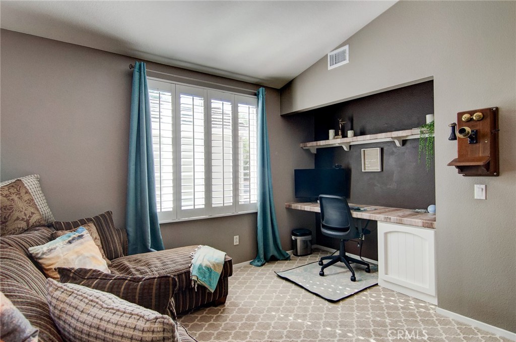 13069 Arborwalk Lane Tustin, CA 92782 - Photo 25 of 47 a bedroom with furniture and a window