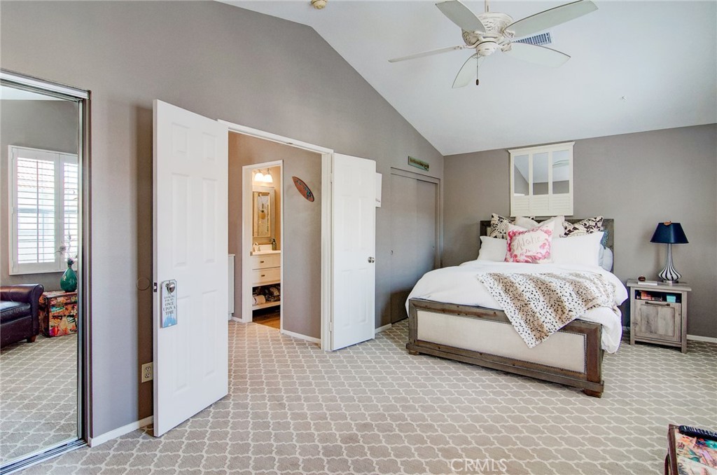 13069 Arborwalk Lane Tustin, CA 92782 - Photo 29 of 47 a bedroom with a bed and a chandelier