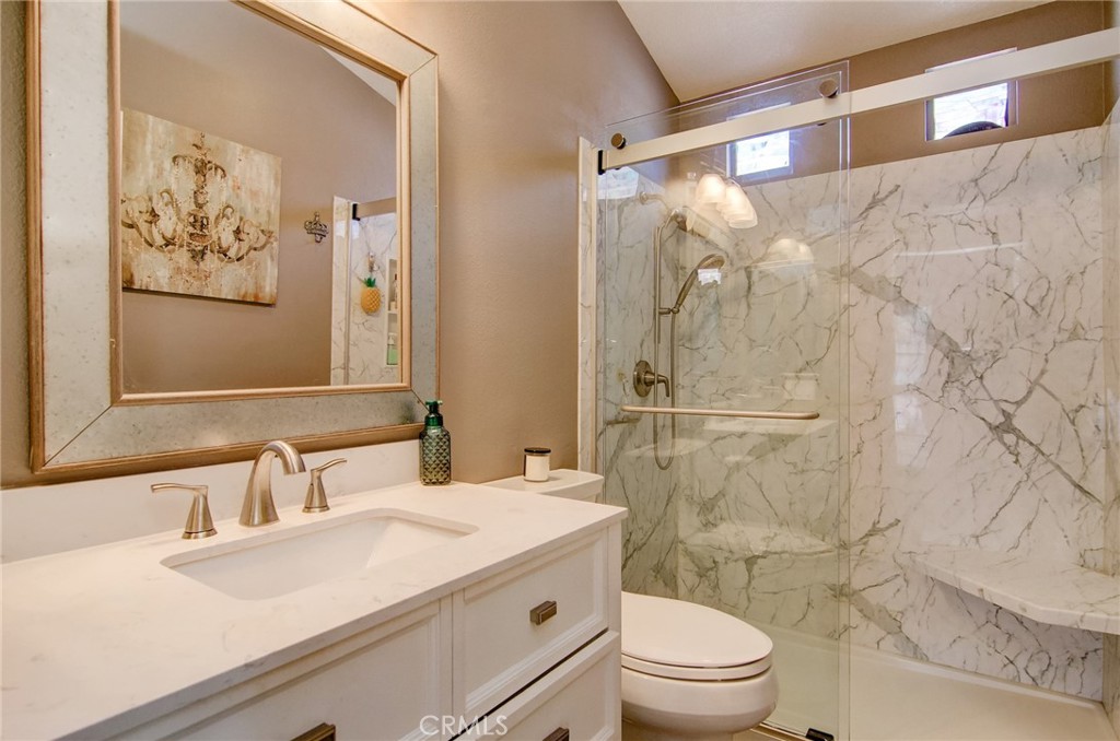 13069 Arborwalk Lane Tustin, CA 92782 - Photo 30 of 47 a bathroom with a sink a toilet and shower