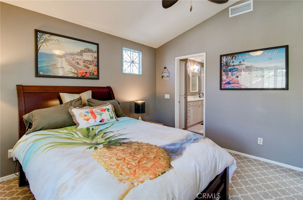 13069 Arborwalk Lane Tustin, CA 92782 - Photo 32 of 47 a bedroom with a bed and painting on the wall