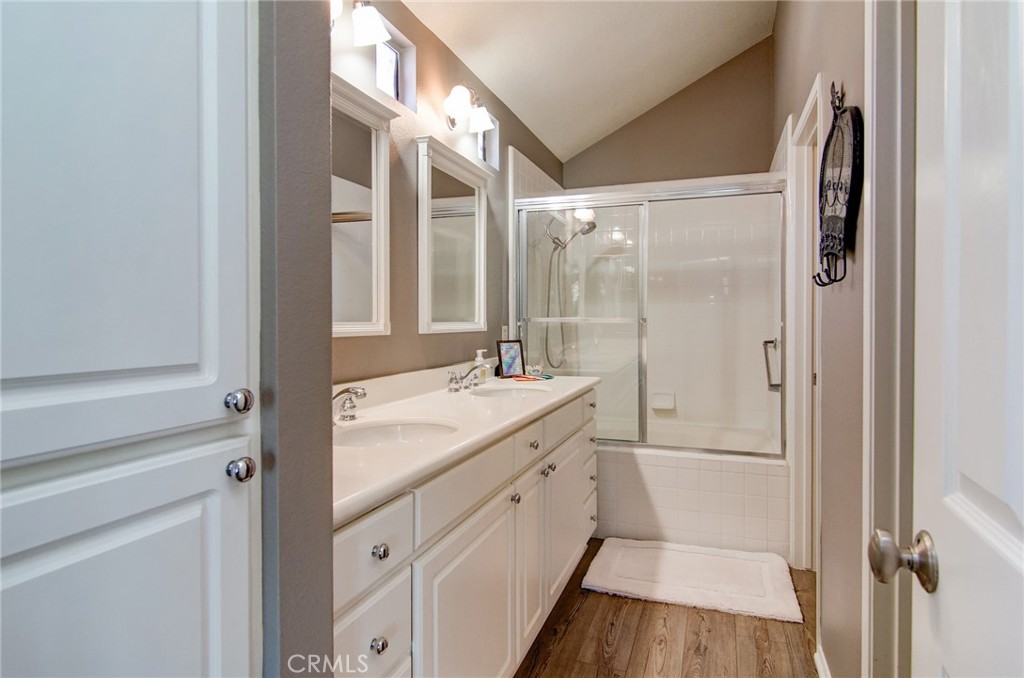 13069 Arborwalk Lane Tustin, CA 92782 - Photo 33 of 47 a spacious bathroom with a shower sink and mirror