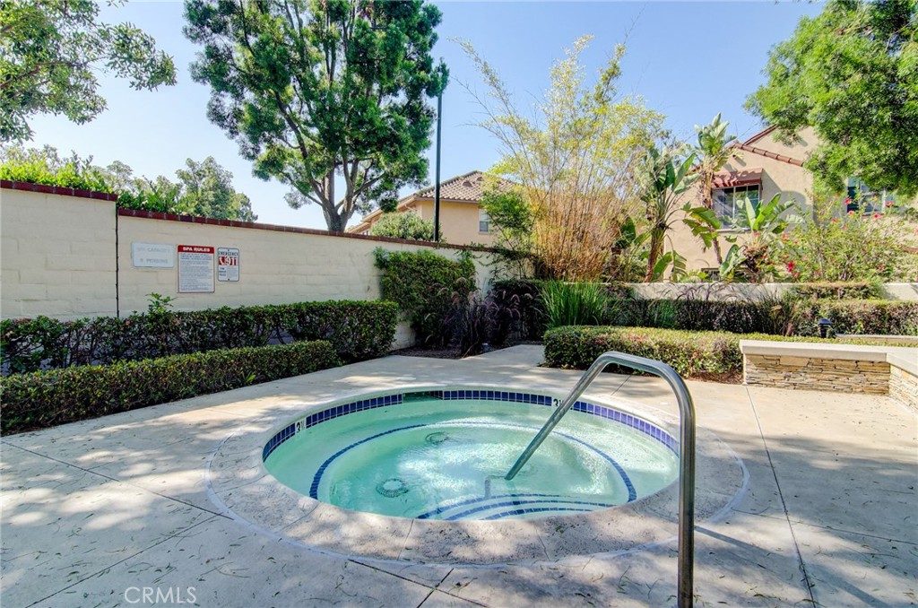13069 Arborwalk Lane Tustin, CA 92782 - Photo 42 of 47 a view of a swimming pool with a patio