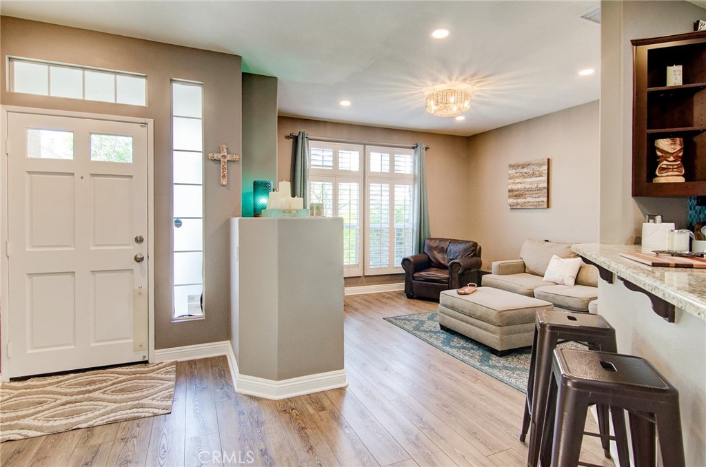 13069 Arborwalk Lane Tustin, CA 92782 - Photo 10 of 47 a living room with furniture and a wooden floor