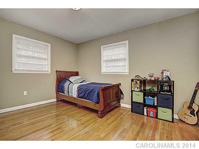 2132 Dunlap Roddey Road Rock Hill, SC 29730 - Photo 13 of 16 a bedroom with a bed and a bookshelf
