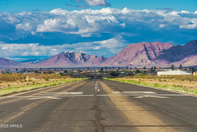a view of an swimming pool and a yard
