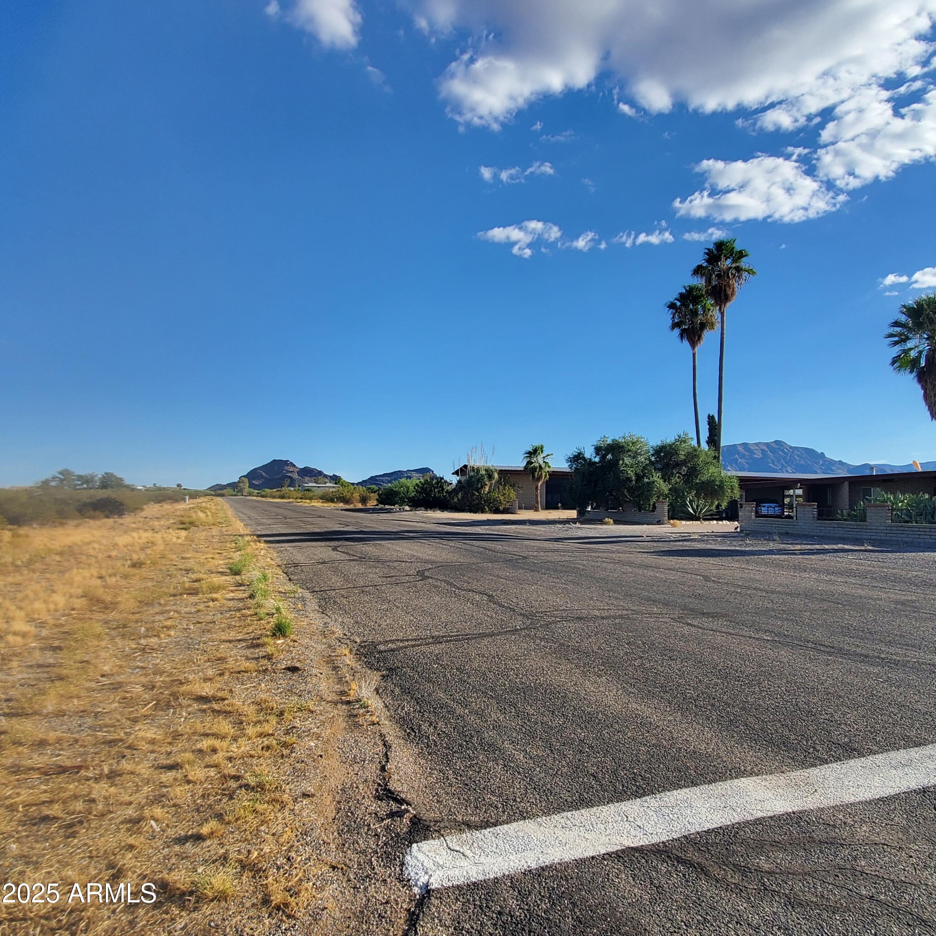50979 West Iver Road Aguila, AZ 85320 - Photo 11 of 21 a view of a lake with sunset