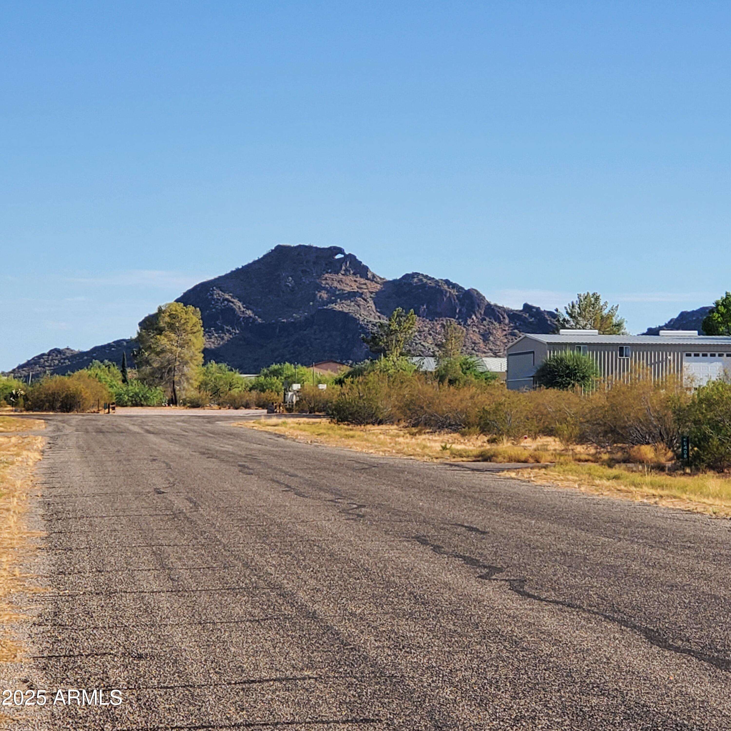 50979 West Iver Road Aguila, AZ 85320 - Photo 18 of 21 a view of a street with a ocean view