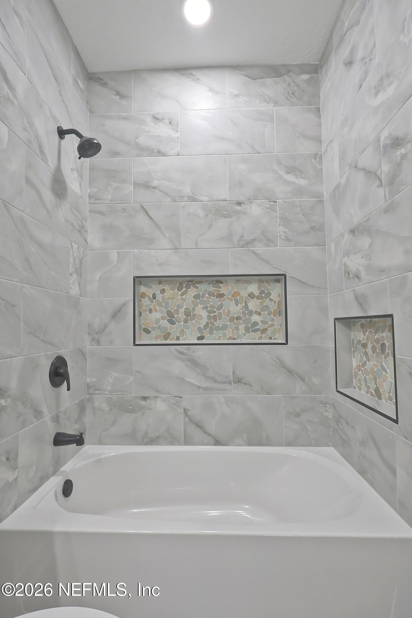 30 Delmonte Street Baldwin, FL 32234 - Photo 29 of 37 a bathroom with a shower
