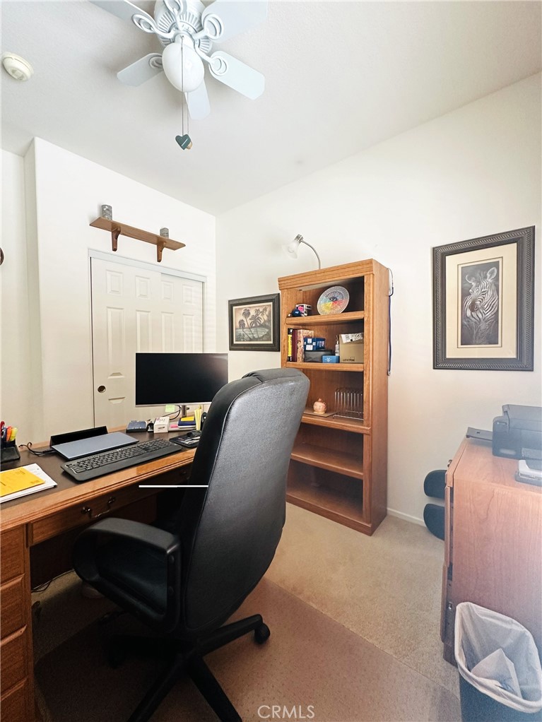 1665 Ravenswood Road Beaumont, CA 92223 - Photo 21 of 41 a workspace with furniture and lamp
