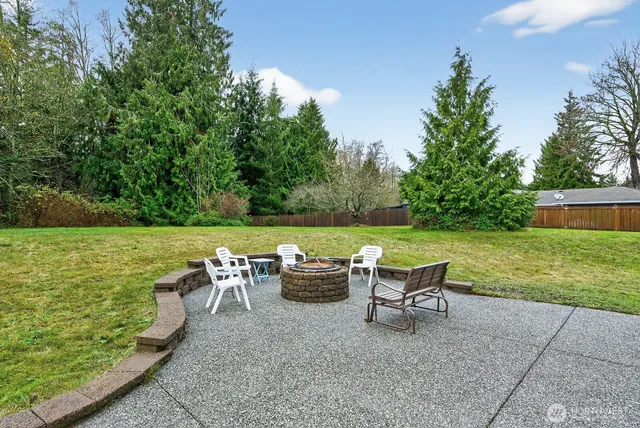 a view of a chair and table on the garden