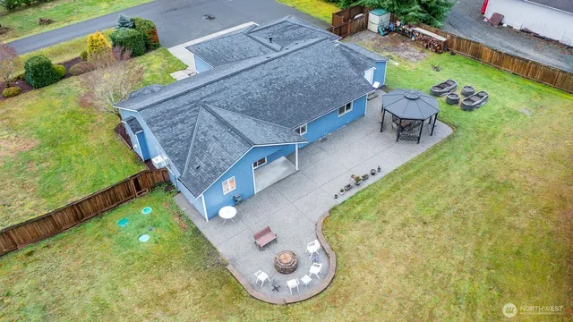 an aerial view of a house with a swimming pool