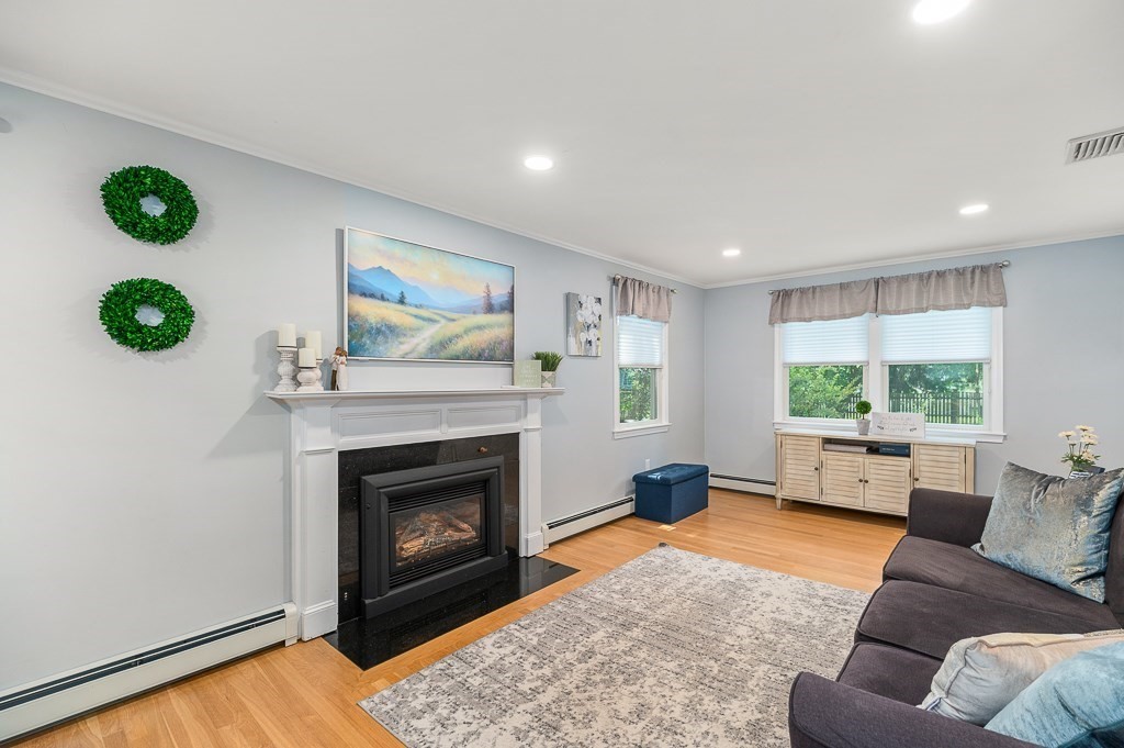 31 Orchard Road Hamilton, MA 01982 - Photo 17 of 41 a living room with furniture and a fireplace