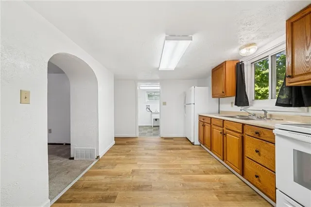 a large bathroom with a sink and a mirror
