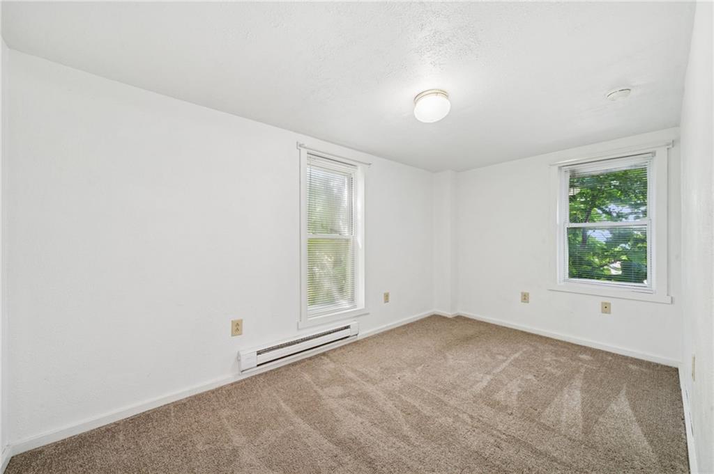 311 Lowell Street Vandergrift, PA 15690 - Photo 15 of 25 an empty room with windows