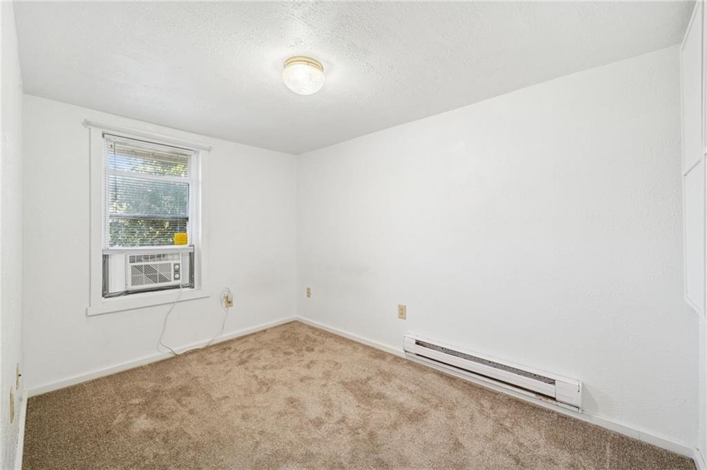 311 Lowell Street Vandergrift, PA 15690 - Photo 19 of 25 an empty room with a window