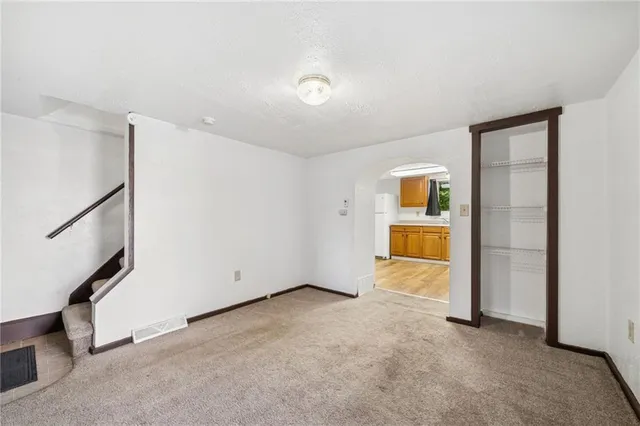 a view of an empty room with a window