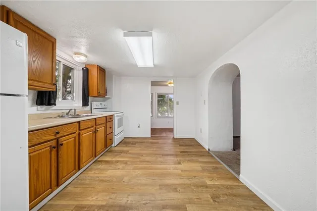 a large bathroom with a sink a mirror and a bathtub