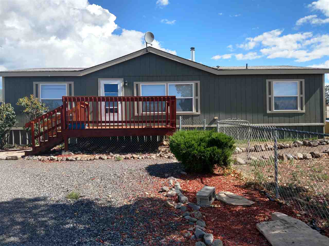19776 Ward Creek Road Cedaredge, CO 81413 - Photo 1 of 25 a front view of a house with a yard