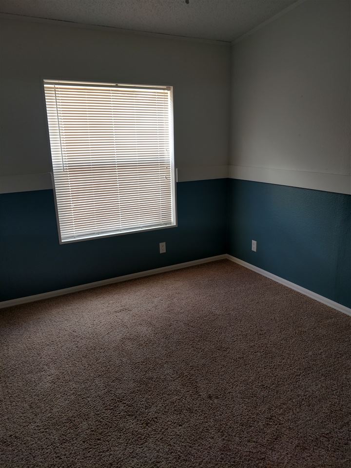 19776 Ward Creek Road Cedaredge, CO 81413 - Photo 13 of 25 an empty room with a window