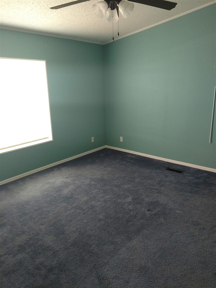 19776 Ward Creek Road Cedaredge, CO 81413 - Photo 14 of 25 an empty room with a window