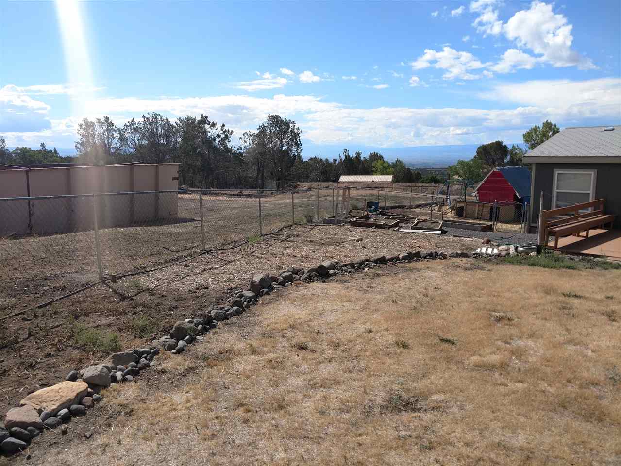 19776 Ward Creek Road Cedaredge, CO 81413 - Photo 17 of 25 a view of a dry yard with wooden fence