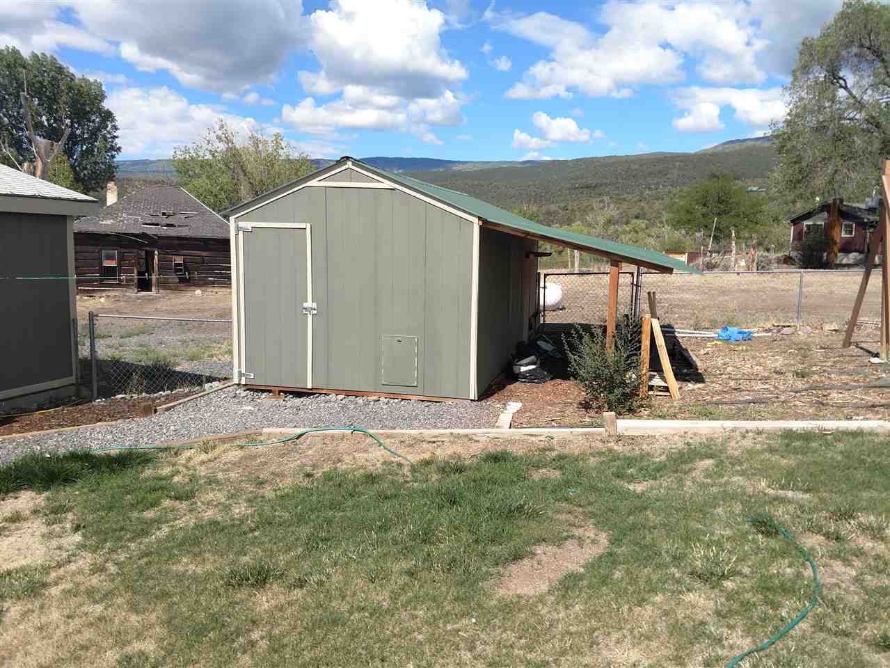 19776 Ward Creek Road Cedaredge, CO 81413 - Photo 20 of 25 a view of a house with backyard