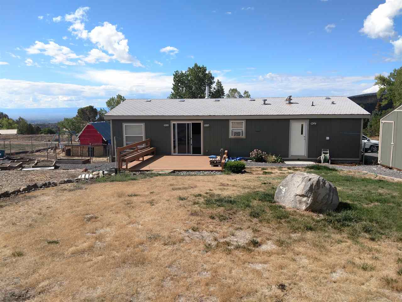 19776 Ward Creek Road Cedaredge, CO 81413 - Photo 21 of 25 a view of a house with a patio