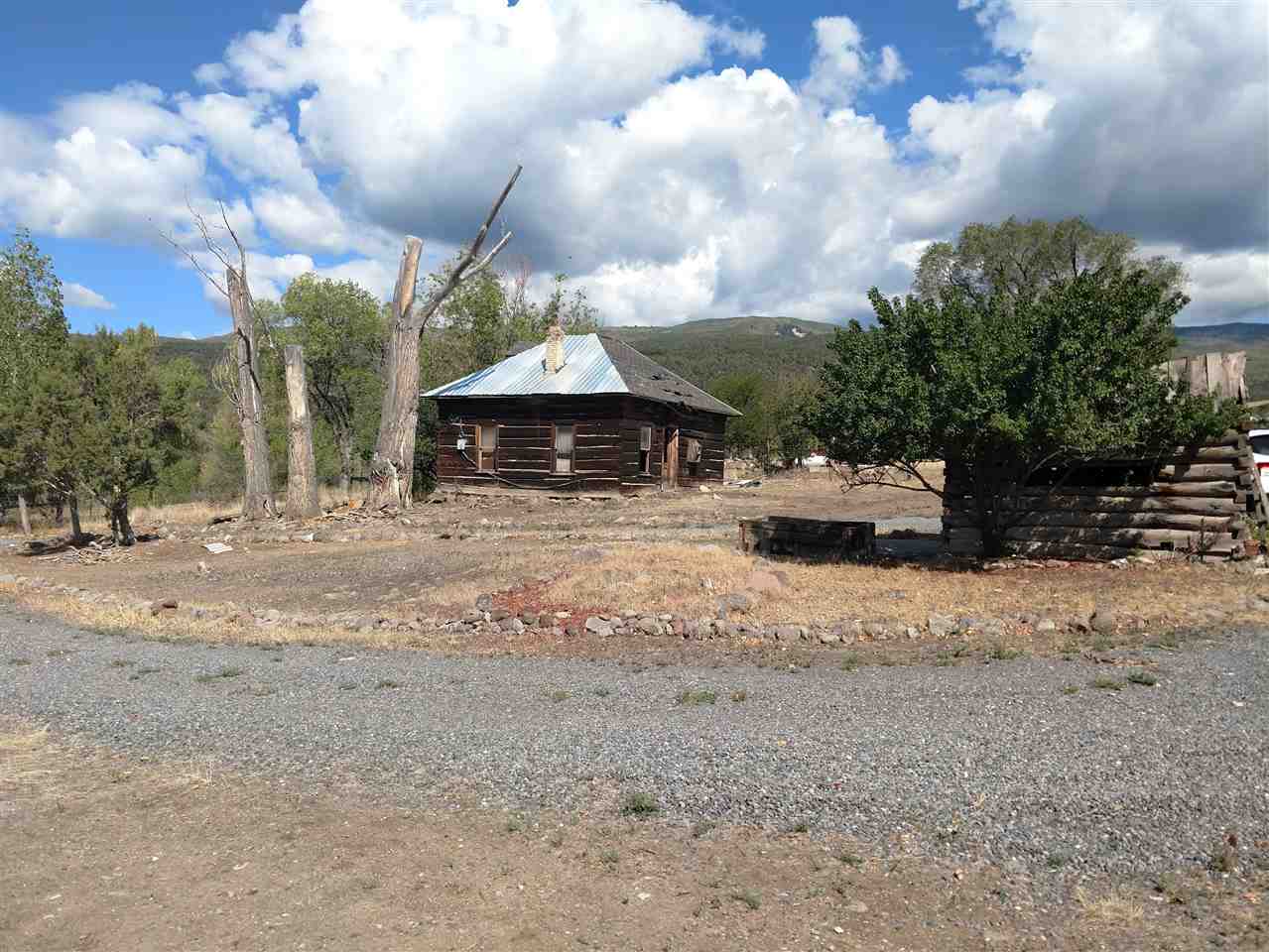 19776 Ward Creek Road Cedaredge, CO 81413 - Photo 22 of 25 a view of a house with a yard