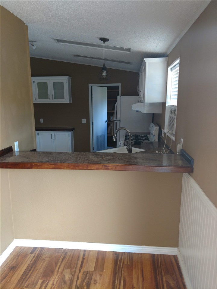 19776 Ward Creek Road Cedaredge, CO 81413 - Photo 8 of 25 a view of kitchen with furniture and wooden floor