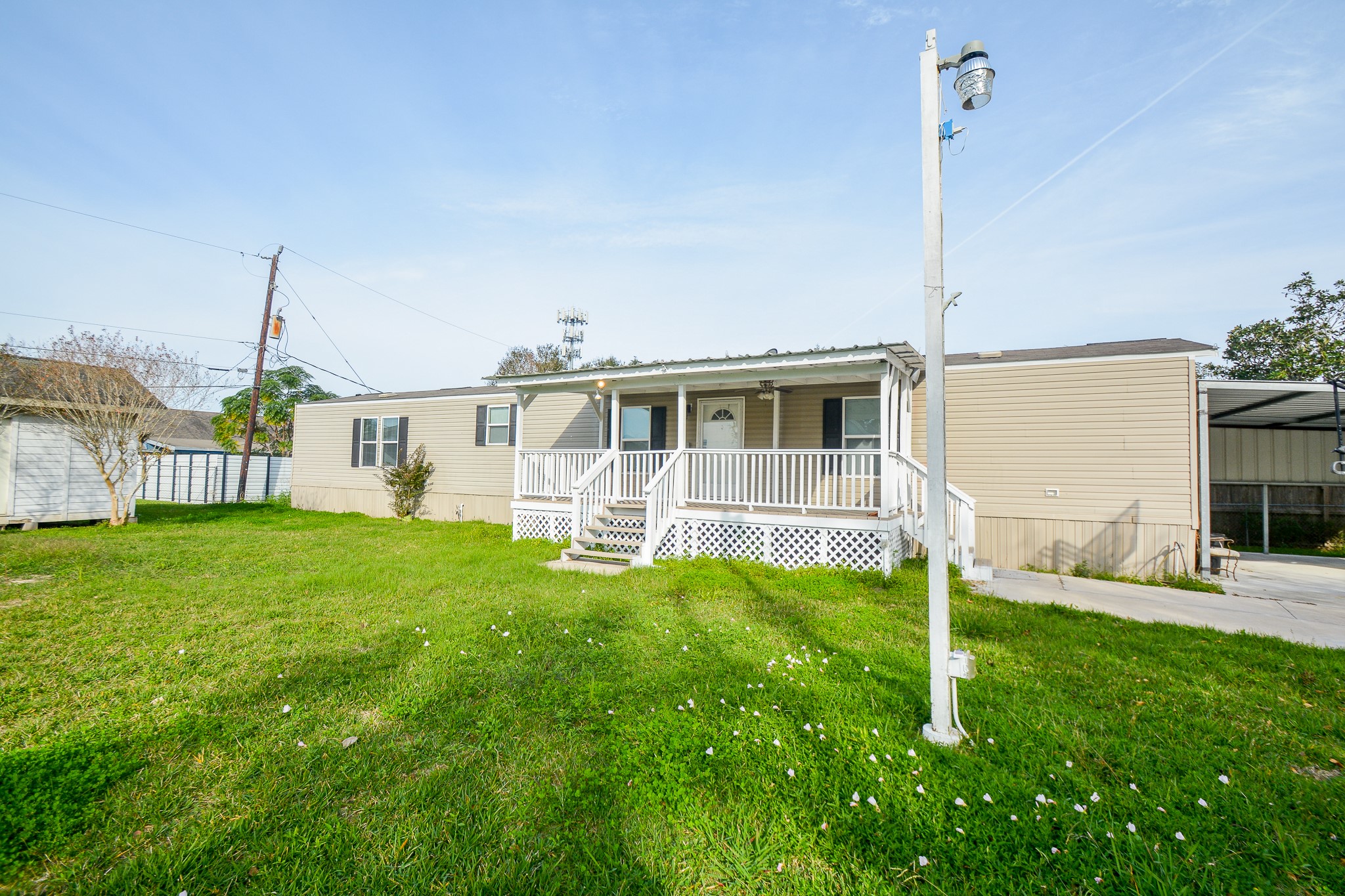 a house view with a sitting space and garden