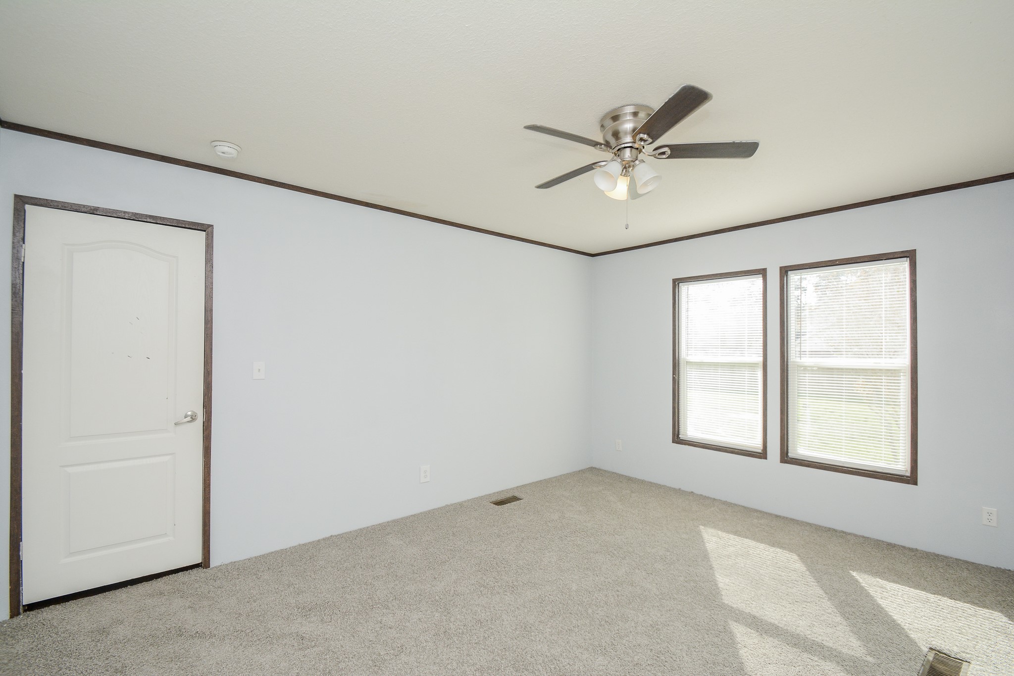 3610 Alice Street Fresno, TX 77545 - Photo 11 of 26 an empty room with windows and fan