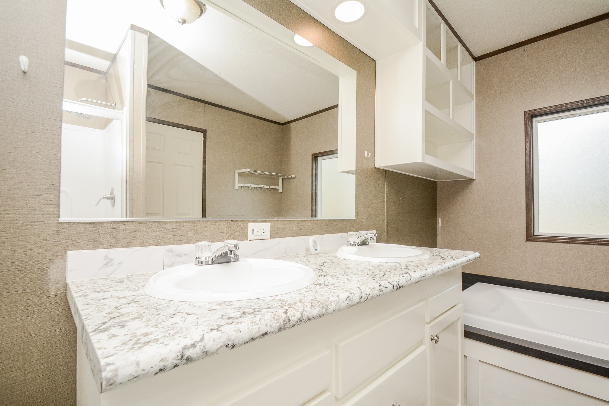 3610 Alice Street Fresno, TX 77545 - Photo 12 of 26 a bathroom with a granite countertop sink a mirror and a shower